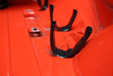 PVC tabs that protect a wire harness on a Porsche 911.